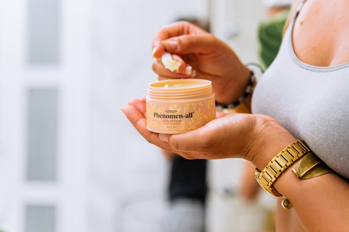 Person holding Alexandria Professional Phenomen-all Skin Repair Cream