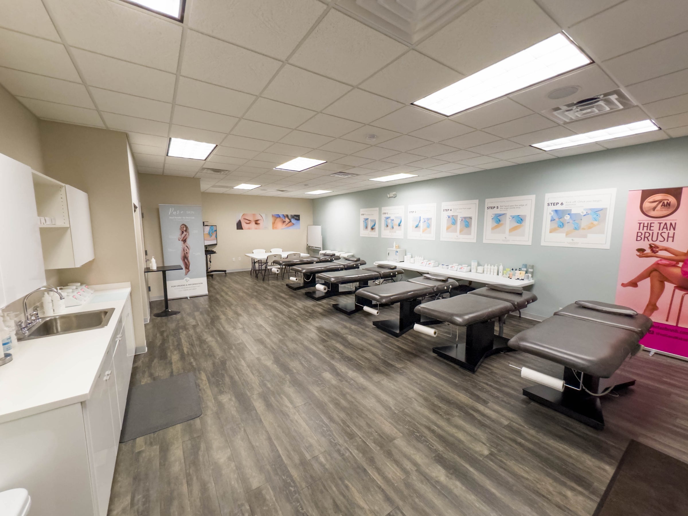 room with multiple tanning beds