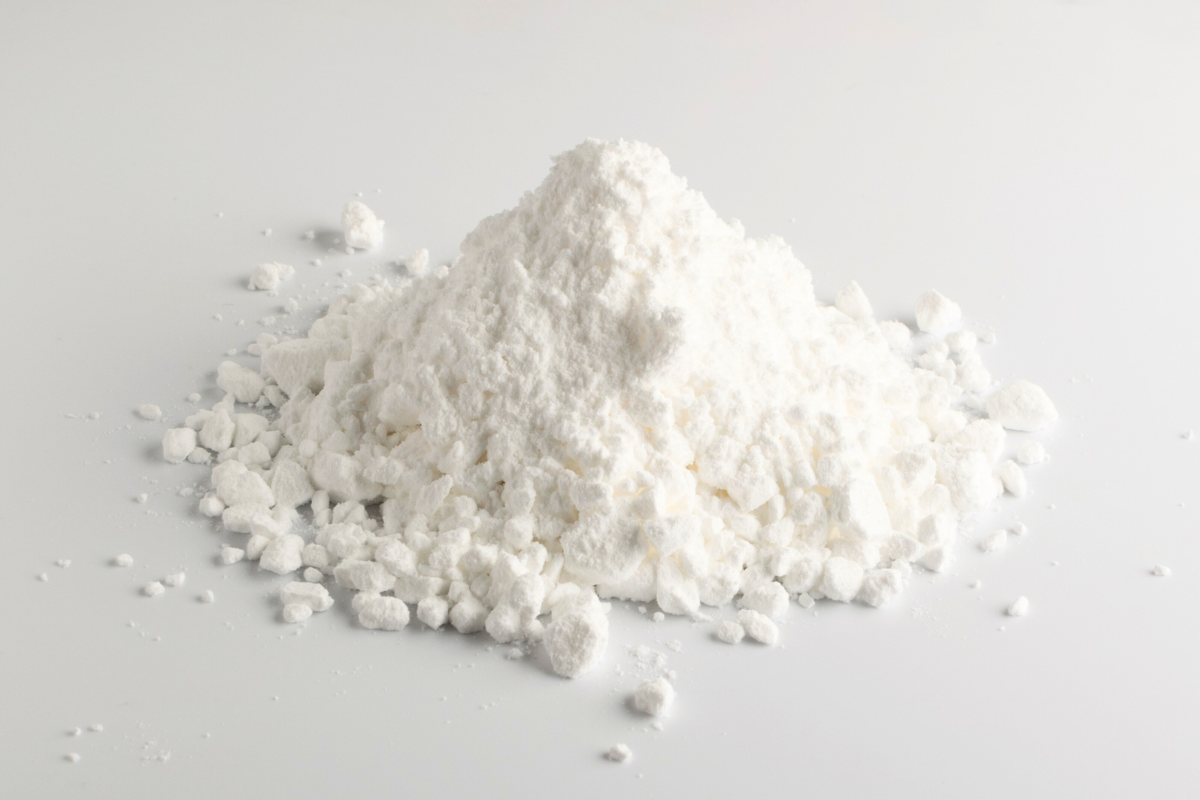small pile of Alexandria Professional's Body Comfort drying powder for odor control and chaffing prevention