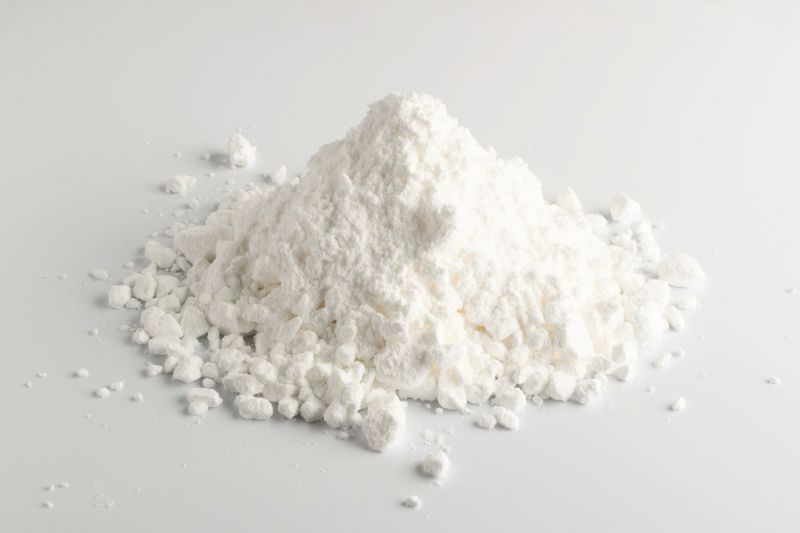 small pile of Alexandria Professional's Body Comfort drying powder for odor control and chaffing prevention